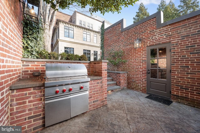 view of patio / terrace featuring exterior kitchen and area for grilling