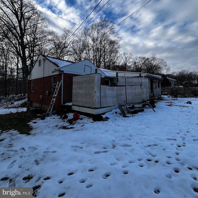 view of snow covered property