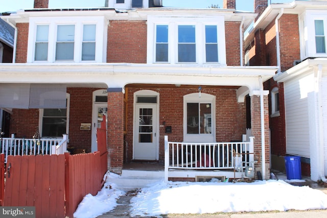 townhome / multi-family property with covered porch