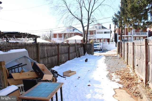 view of yard layered in snow