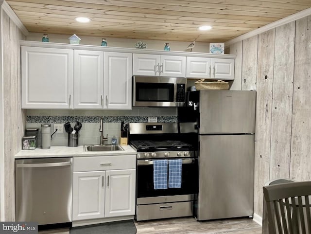 kitchen with white cabinetry, sink, wood ceiling, and appliances with stainless steel finishes