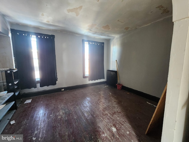 empty room featuring hardwood / wood-style flooring