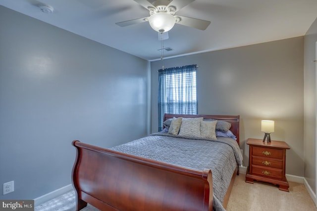 carpeted bedroom featuring visible vents, ceiling fan, and baseboards