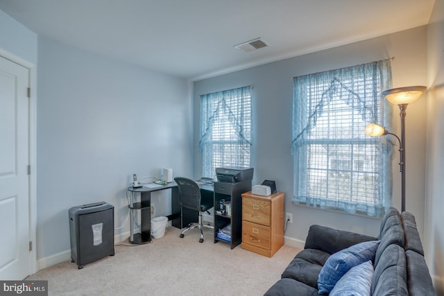 home office with carpet, visible vents, and baseboards