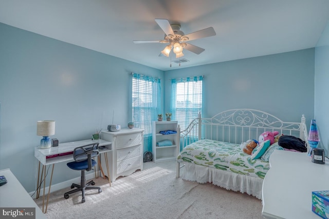 bedroom featuring ceiling fan, carpet, visible vents, and baseboards