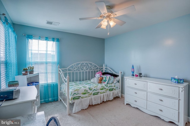 bedroom featuring ceiling fan, visible vents, and carpet flooring