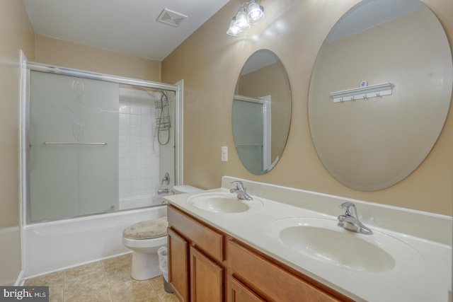 full bath with toilet, visible vents, a sink, and tile patterned floors