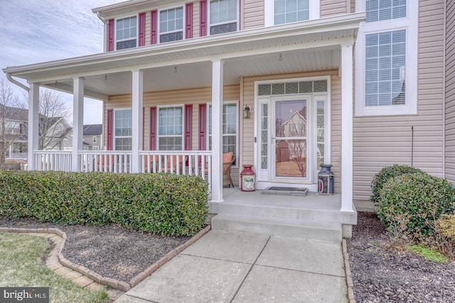 entrance to property with a porch