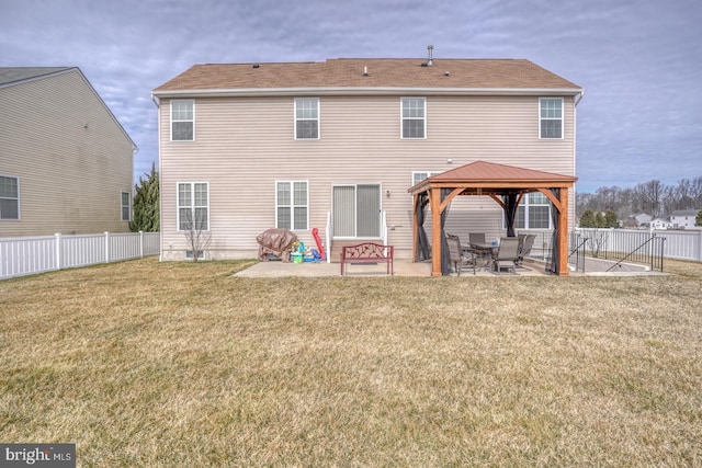 rear view of house with a patio area, fence, a lawn, and a gazebo