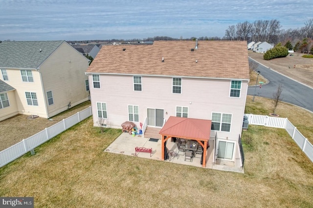 rear view of property with a lawn, a patio area, a fenced backyard, and cooling unit