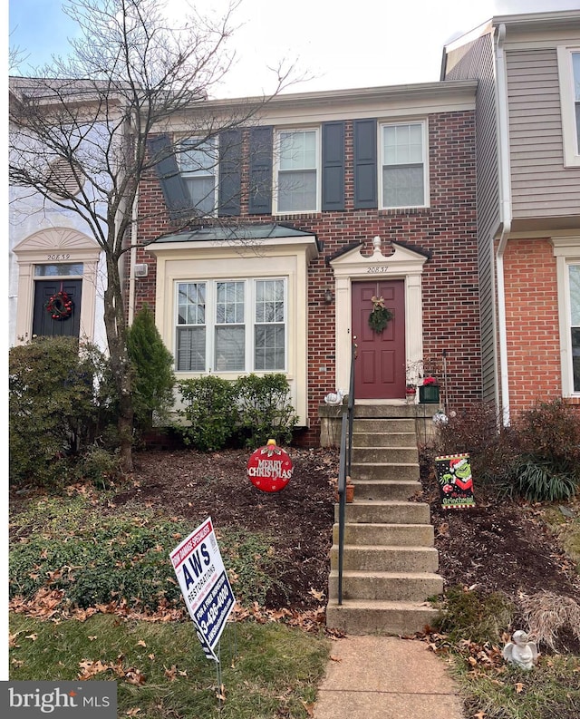 view of property with brick siding