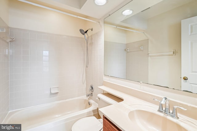 full bath with visible vents,  shower combination, vanity, and toilet