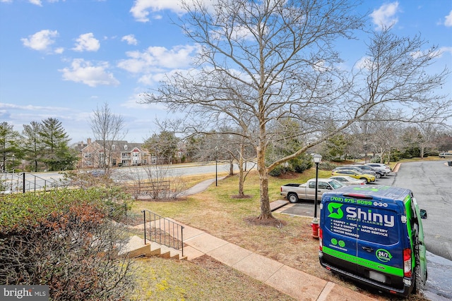 view of property's community featuring uncovered parking