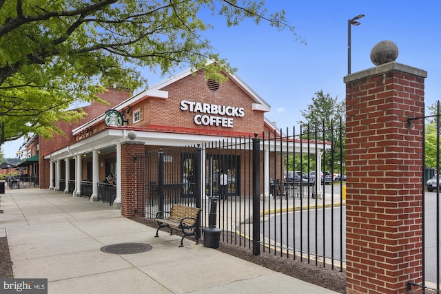 view of building exterior with fence