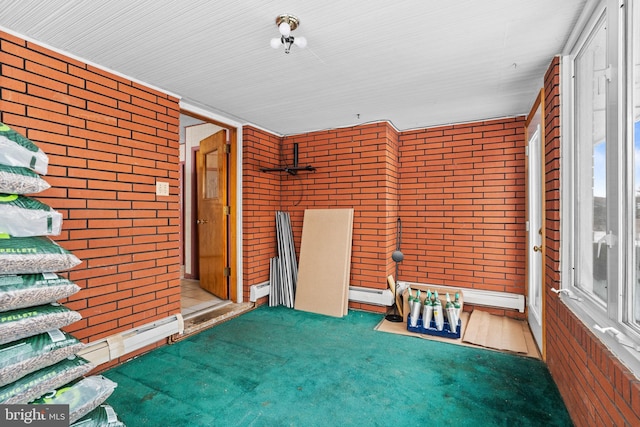 unfurnished sunroom featuring a baseboard radiator