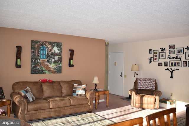 living room with a textured ceiling and carpet flooring