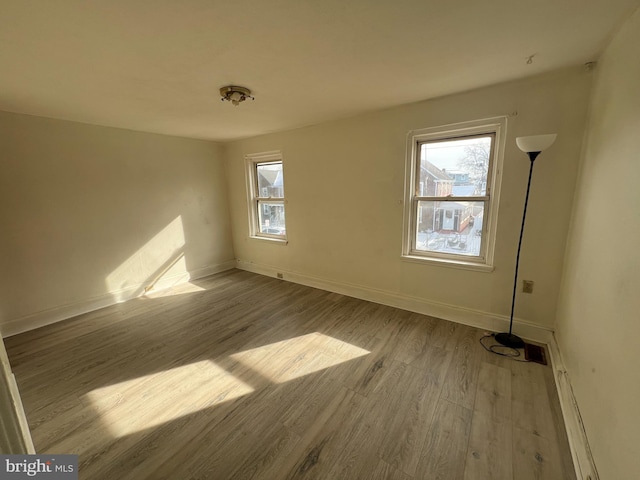 empty room with light hardwood / wood-style floors