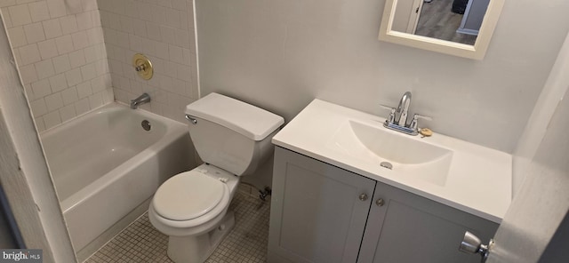 full bathroom with tiled shower / bath, vanity, toilet, and tile patterned flooring