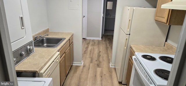 kitchen featuring sink, white appliances, and light hardwood / wood-style flooring