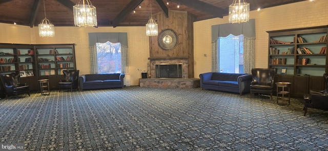 carpeted living room featuring beamed ceiling, wood ceiling, a fireplace, and high vaulted ceiling