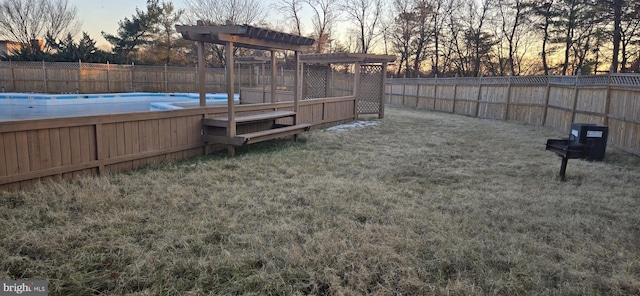 yard at dusk with a pool