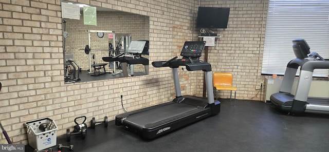 exercise area with brick wall