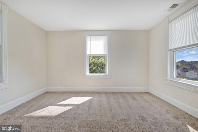 empty room with light colored carpet