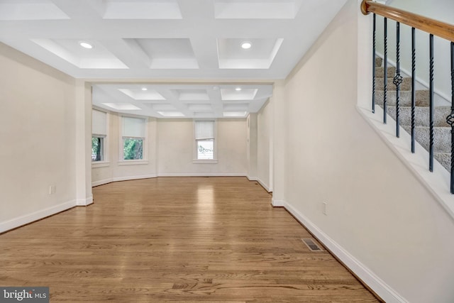 interior space with coffered ceiling, hardwood / wood-style floors, and beam ceiling