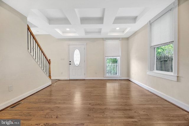 foyer with coffered ceiling, hardwood / wood-style floors, and beamed ceiling