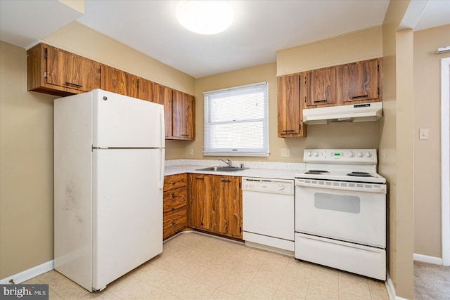 kitchen featuring sink and white appliances