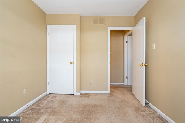 unfurnished bedroom with light carpet