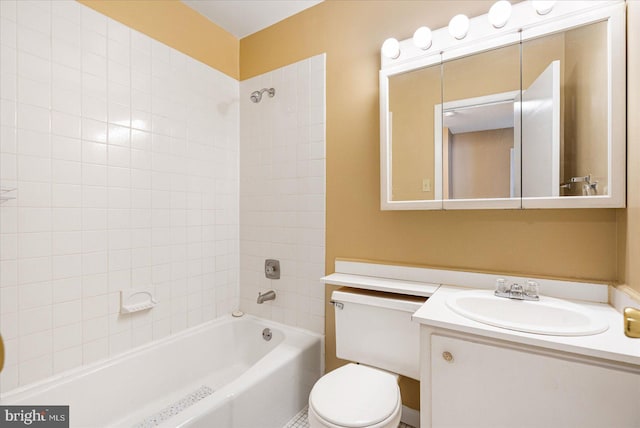 full bathroom with toilet, vanity, and tiled shower / bath combo