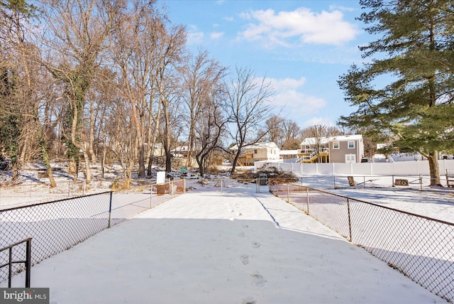 view of yard layered in snow