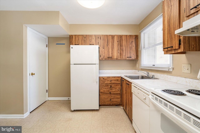 kitchen with sink and white appliances