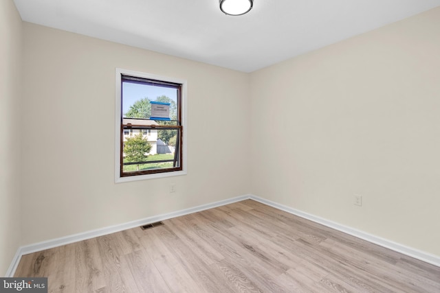 spare room featuring light hardwood / wood-style flooring