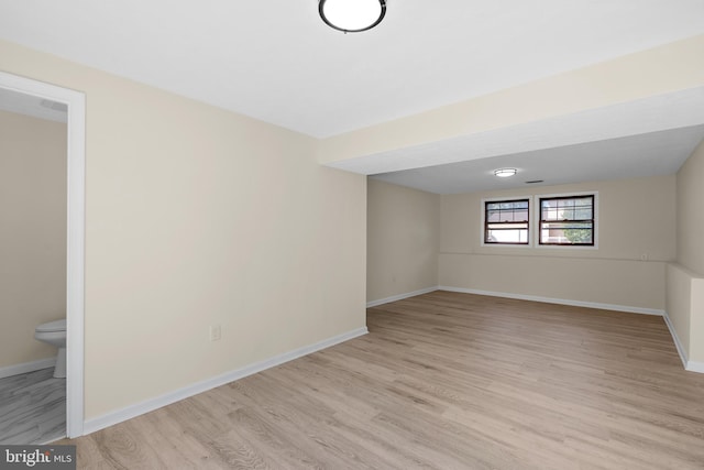 unfurnished room with light wood-type flooring