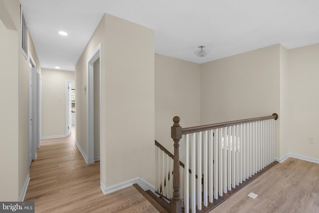 corridor featuring light hardwood / wood-style flooring