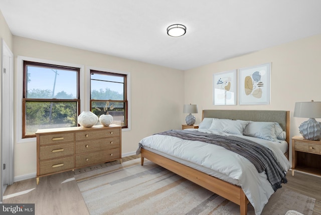 bedroom with light hardwood / wood-style floors