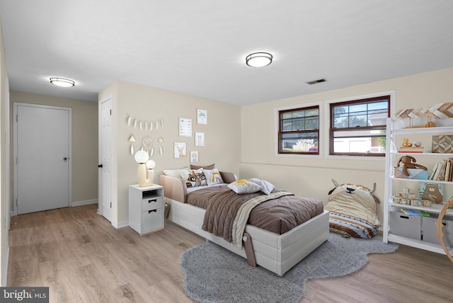 bedroom with light hardwood / wood-style floors