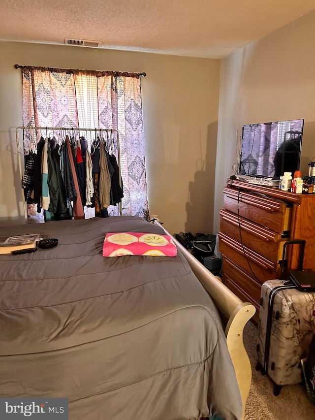 bedroom with a textured ceiling