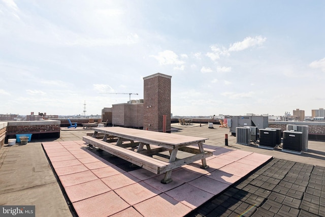 view of patio featuring outdoor dining space and a city view