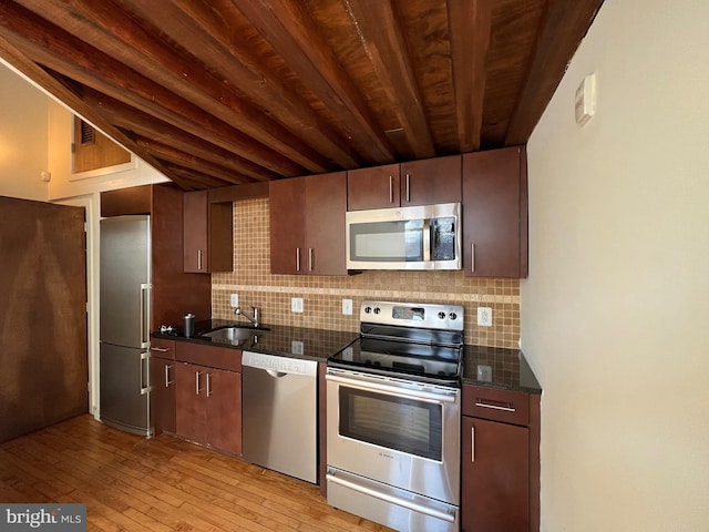 kitchen featuring tasteful backsplash, sink, wooden ceiling, and appliances with stainless steel finishes