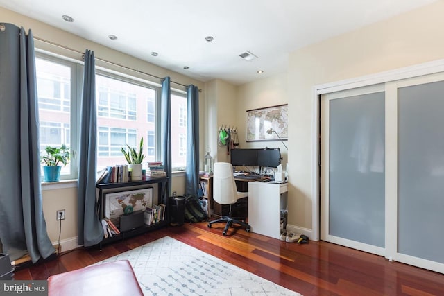 office with dark hardwood / wood-style floors