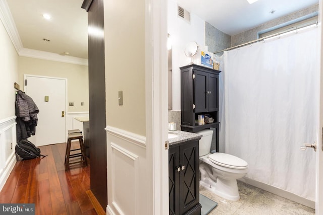 bathroom featuring vanity, ornamental molding, toilet, and a shower with shower curtain