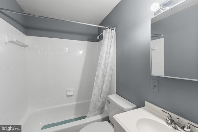 full bathroom with shower / bath combo, vanity, and toilet