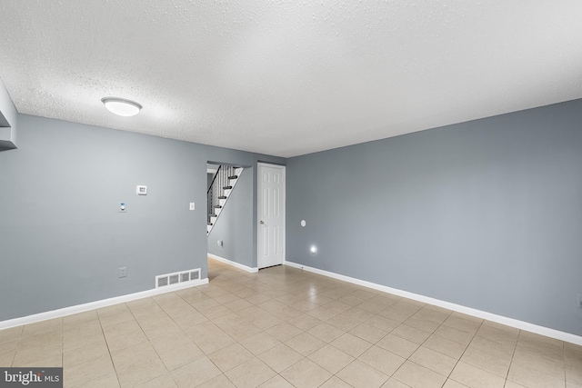 empty room with a textured ceiling