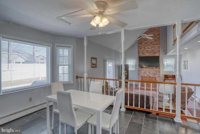 dining space with ceiling fan, a baseboard radiator, and lofted ceiling