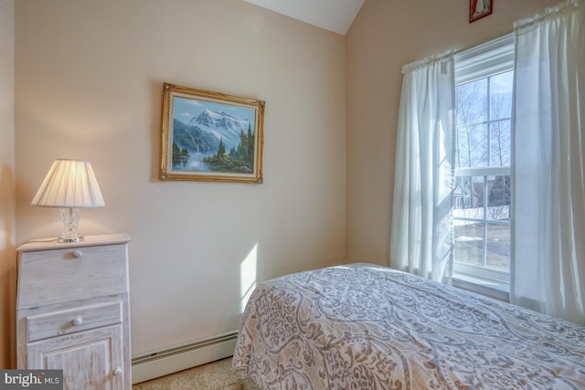 bedroom featuring vaulted ceiling and baseboard heating