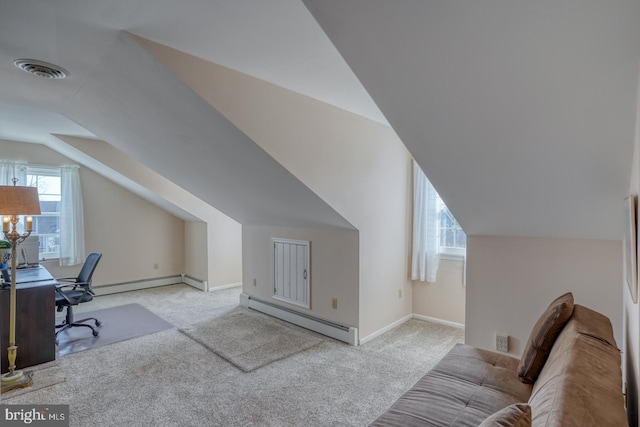 carpeted office with baseboard heating and vaulted ceiling