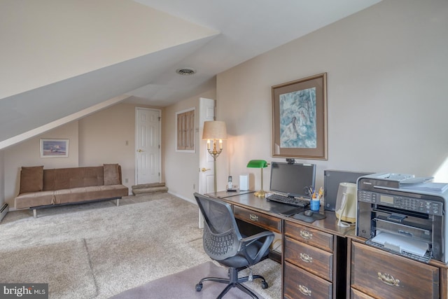 carpeted office space with lofted ceiling